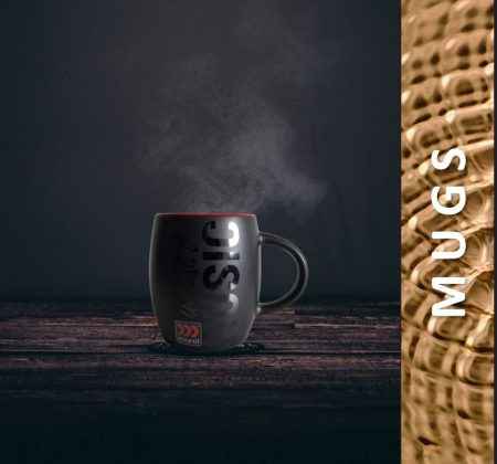 Steaming dark gray Morel Mug with bold black design on rustic wooden surface