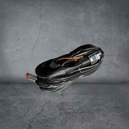 Ultra Vision LED Spotlight Light Bar Wiring Harness neatly coiled on gray surface